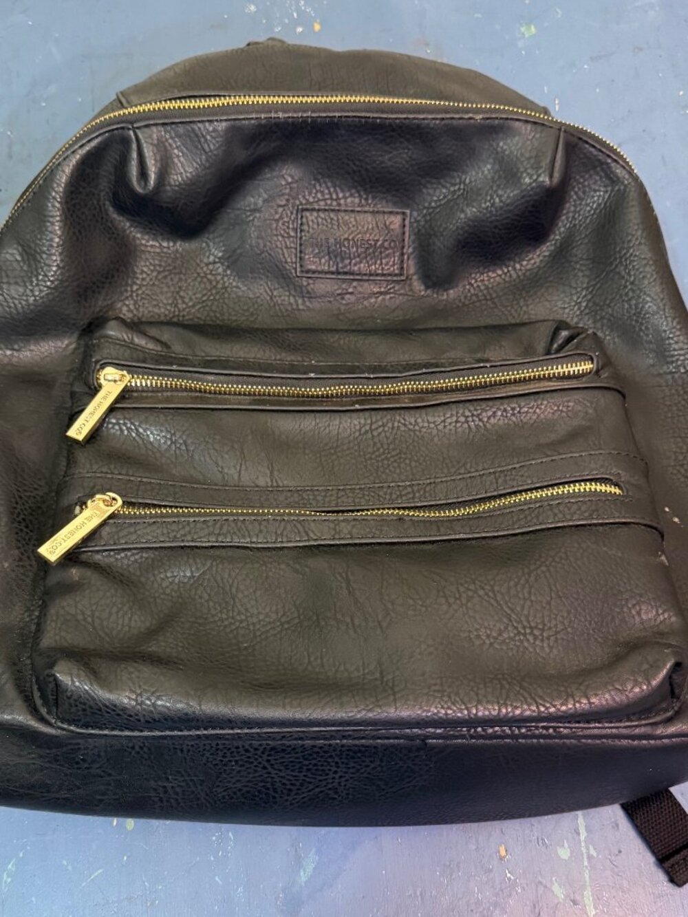 The Honest Co City Black Vegan Leather Diaper City Backpack w gold hardware